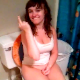 A very pretty brunette girl is video-recorded sitting on a toilet while drunk as her friends laugh at her antics. We are not sure if she is peeing, pooping, or both. Regardless, she sure looks good on the toilet!